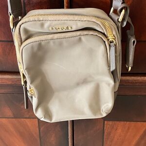 Tumi Beige Messenger Bag with Gold Accents